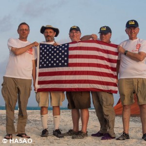 US team members with flag