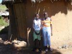 The girls with the old hut in donated clothes in March 2010